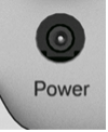A small round hole. The power supply cable plugs into it